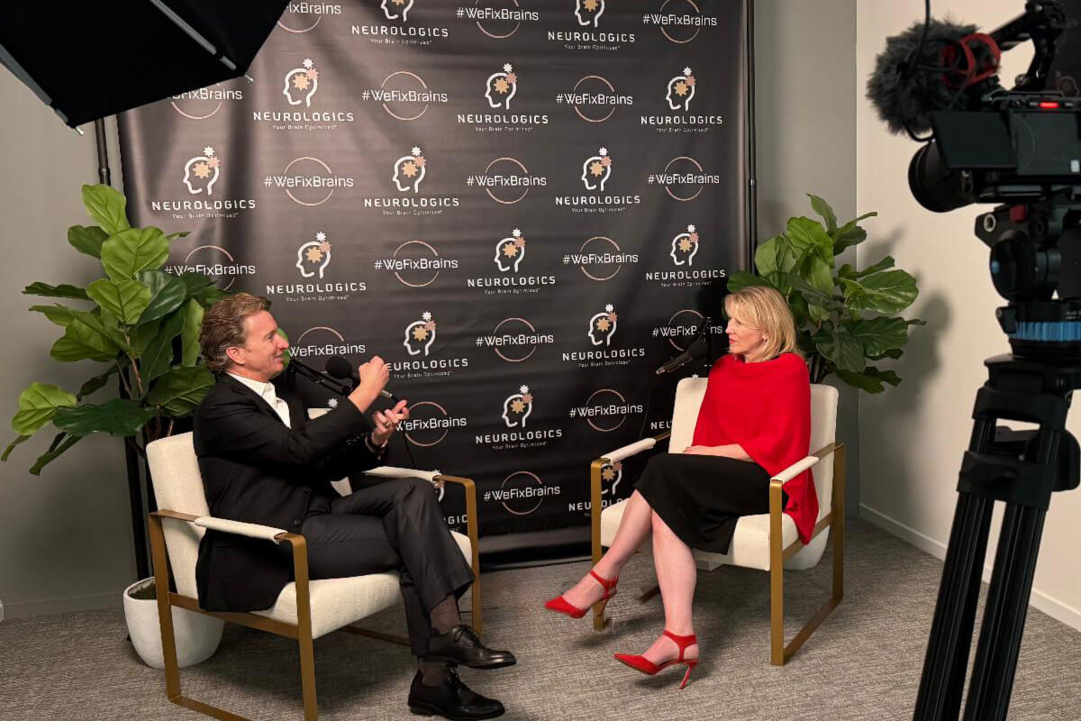 A candid moment shows attendees talking and smiling together during a social event.